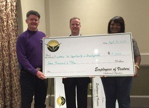 Above: Tom Mason and Sherrye Robinson present Alliance for Opportunity and Development with a check from Venturi Employees