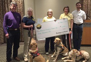 Above: Derek Johns and Tom Mason present North Alabama Search Dog Association with a check from the employees of Venturi